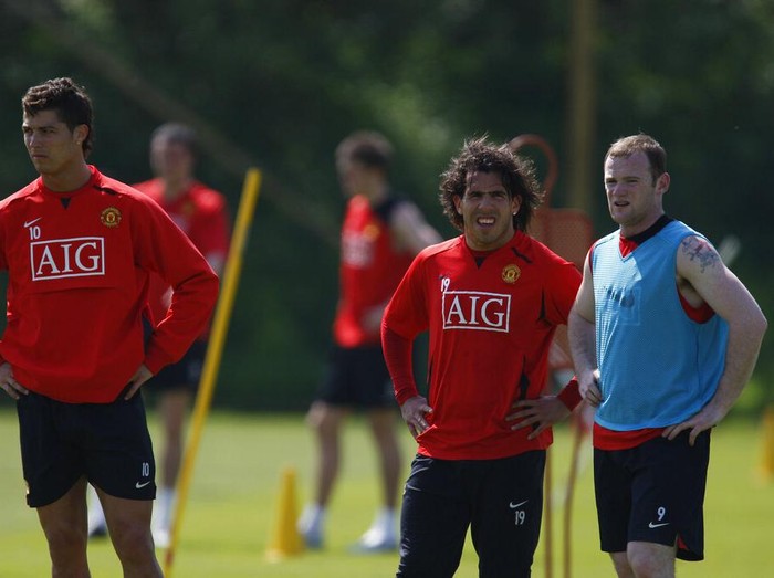 Manchester United's Cristiano Ronaldo, left, Carlos Tevez and Wayne Rooney, right, look on during a practice session at Carrington training ground in Manchester, England, Thursday May 15, 2008. Manchester United will play Chelsea in the Champion's League final soccer match at the Luzhniki Stadium in Moscow on May 21. (AP Photo/Jon Super)