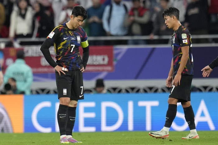 South Koreas Son Heung-min, left, and South Koreas Jeong Woo-yeong are dejected after the Asian Cup semifinal soccer match between South Korea and Jordan at Ahmad Bin Ali Stadium in Al Rayyan, Qatar, Tuesday, Feb. 6, 2024. Jordan won 2-0. (AP Photo/Aijaz Rahi)
