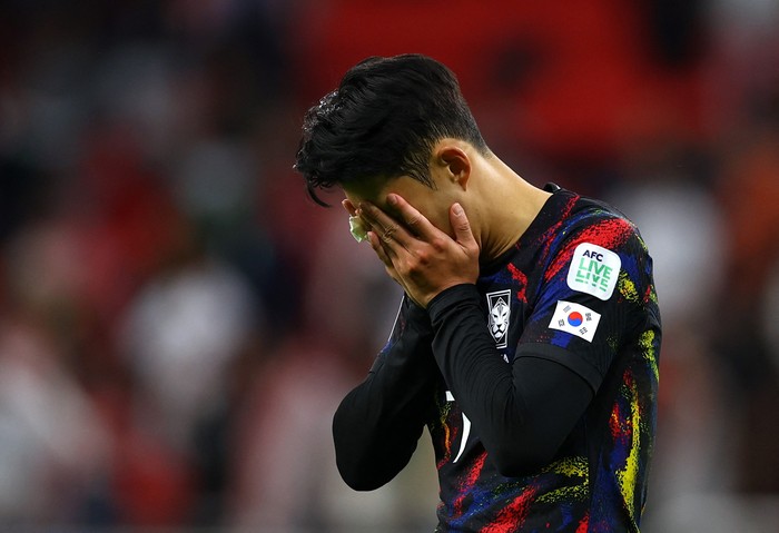 Soccer Football - AFC Asian Cup - Semi Final - Jordan v South Korea - Ahmed bin Ali Stadium, Al Rayyan, Qatar - February 6, 2024 South Koreas Son Heung-Min looks dejected after being eliminated from the AFC Asian Cup REUTERS/Molly Darlington