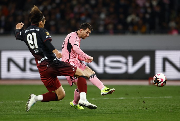 Soccer Football - Friendly - Vissel Kobe v Inter Miami - Japan National Stadium, Tokyo, Japan - February 7, 2024 Inter Miamis Lionel Messi in action with Vissel Kobes Ryuho Kikuchi REUTERS/Issei Kato