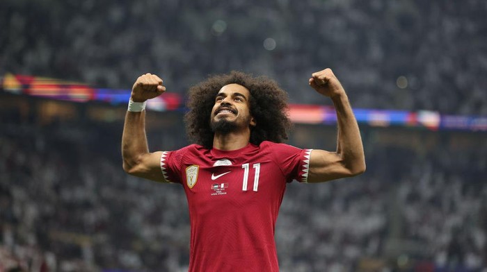 LUSAIL CITY, QATAR - FEBRUARY 10: Akram Afif of Qatar celebrates scoring his teams second goal from the penalty spot during the AFC Asian Cup final match between Jordan and Qatar at Lusail Stadium on February 10, 2024 in Lusail City, Qatar. (Photo by Robert Cianflone/Getty Images)