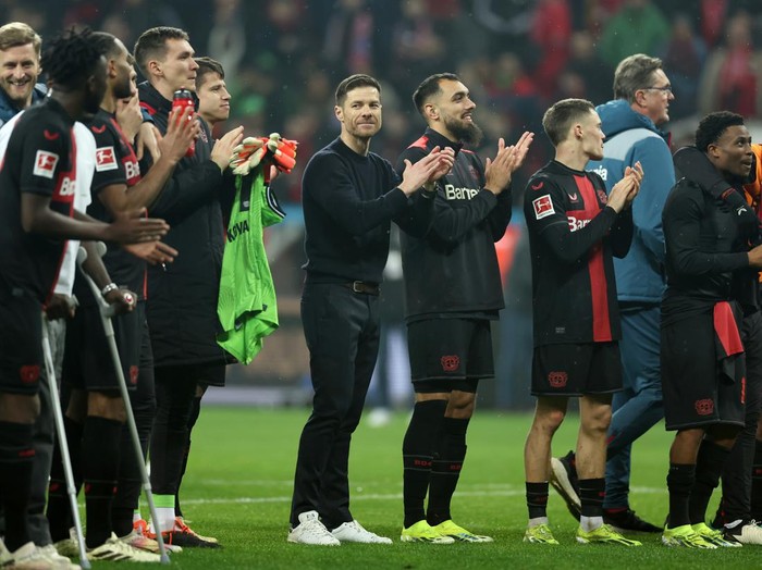 LEVERKUSEN, GERMANY - FEBRUARY 10: Xabi Alonso, Manager of Bayer Leverkusen, applauds the fans following the teams victory during the Bundesliga match between Bayer 04 Leverkusen and FC Bayern München at BayArena on February 10, 2024 in Leverkusen, Germany. (Photo by Lars Baron/Getty Images)