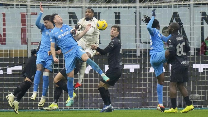 AC Milans goalkeeper Mike Maignansaves a ball during a Serie A soccer match between AC Milan and Napoli, at the San Siro stadium in Milan, Italy, Sunday, Feb. 11, 2024. (AP Photo/Luca Bruno)