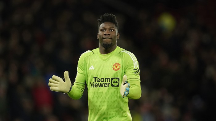 Manchester Uniteds goalkeeper Andre Onana during the English Premier League soccer match between Manchester United and Tottenham Hotspur at the Old Trafford stadium in Manchester, England, Sunday, Jan.14, 2024. (AP Photo/Dave Thompson)