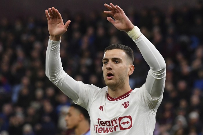 Manchester Uniteds Diogo Dalot reacts during the English Premier League soccer match between Aston Villa and Manchester United at the Villa Park stadium in Birmingham, England, Sunday, Feb. 11, 2024. (AP Photo/Rui Vieira)