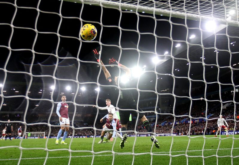 Soccer Football - Premier League - Aston Villa v Manchester United - Villa Park, Birmingham, Britain - February 11, 2024 Manchester United's Scott McTominay scores their second goal past Aston Villa's Emiliano Martinez REUTERS/Carl Recine NO USE WITH UNAUTHORIZED AUDIO, VIDEO, DATA, FIXTURE LISTS, CLUB/LEAGUE LOGOS OR 'LIVE' SERVICES. ONLINE IN-MATCH USE LIMITED TO 45 IMAGES, NO VIDEO EMULATION. NO USE IN BETTING, GAMES OR SINGLE CLUB/LEAGUE/PLAYER PUBLICATIONS.