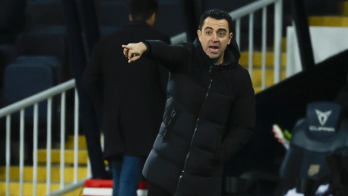 Barcelonas head coach Xavi Hernandez gestures from the sideline during the Spanish La Liga soccer match between Barcelona and Granada at the Olimpic Lluis Companys stadium in Barcelona, Spain, Sunday, Feb. 11, 2024. (AP Photo/Joan Monfort)