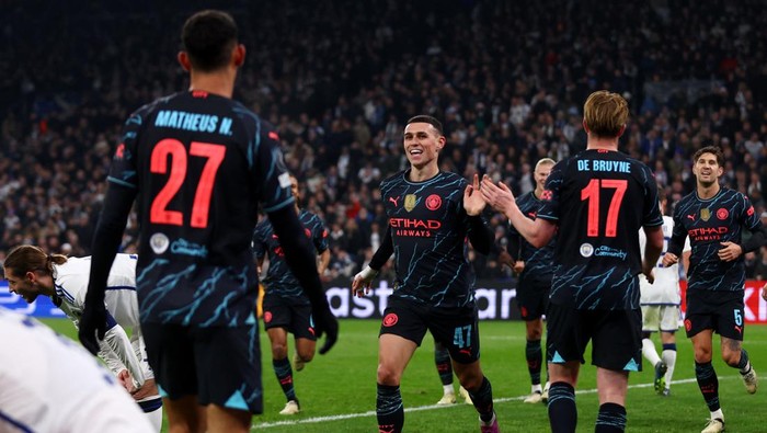 Soccer Football - Champions League - Round of 16 - First Leg - FC Copenhagen v Manchester City - Parken, Copenhagen, Denmark - February 13, 2024 Manchester Citys Phil Foden celebrates scoring their third goal with Kevin De Bruyne and teammates Action Images via Reuters/Matthew Childs