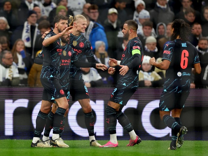 Soccer Football - Champions League - Round of 16 - First Leg - FC Copenhagen v Manchester City - Parken, Copenhagen, Denmark - February 13, 2024 Manchester City's Bernardo Silva celebrates scoring their second goal with Erling Braut Haaland, Kyle Walker and Ruben Dias Action Images via Reuters/Matthew Childs