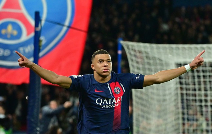 PARIS, FRANCE - FEBRUARY 14Kylian Mbappe of PSG celebrates after scoring his teams first goal during the UEFA Champions League 2023/24 round of 16 first leg match between Paris Saint-Germain and Real Sociedad at Parc des Princes on February 14, 2024 in Paris, France. (Photo by Christian Liewig - Corbis/Getty Images)