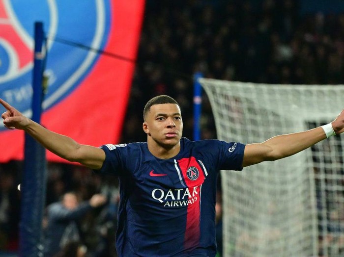 PARIS, FRANCE - FEBRUARY 14Kylian Mbappe of PSG celebrates after scoring his team's first goal during the UEFA Champions League 2023/24 round of 16 first leg match between Paris Saint-Germain and Real Sociedad at Parc des Princes on February 14, 2024 in Paris, France. (Photo by Christian Liewig - Corbis/Getty Images)