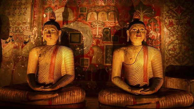 Budhha statues are seen inside the Rangiri Dambulla Cave Temple in Dambulla, some 150 Km (93 Miles) north of Sri Lanka's capital Colombo on February 15, 2024. (Photo by Ishara S. KODIKARA / AFP)