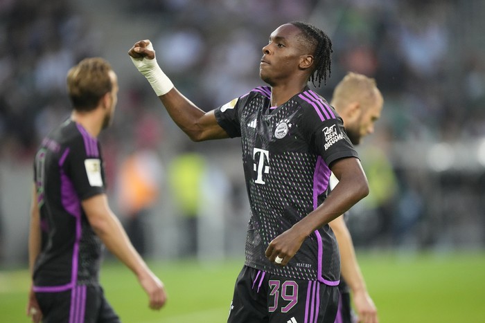 Bayerns Mathys Tel, centre, celebrates after scoring his sides second goal during the German Bundesliga soccer match between Borussia Moenchengladbach and Bayern Munich in Moenchengladbach, Germany, Saturday, Sept. 2, 2023. (AP Photo/Martin Meissner)