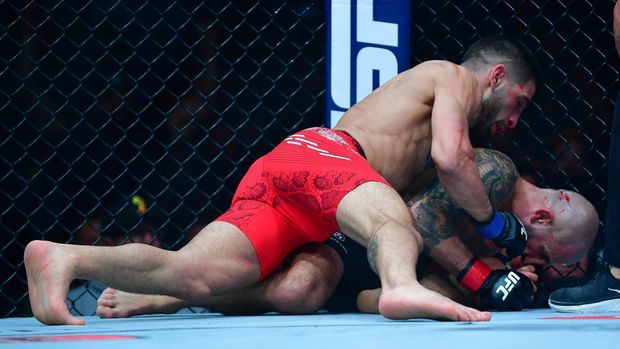 Feb 17, 2024; Anaheim, California, USA; Ilia Topuria lands hits against Alexander Volkanovski for his KO victory during UFC 298 at Honda Center. Mandatory Credit: Gary A. Vasquez-USA TODAY Sports