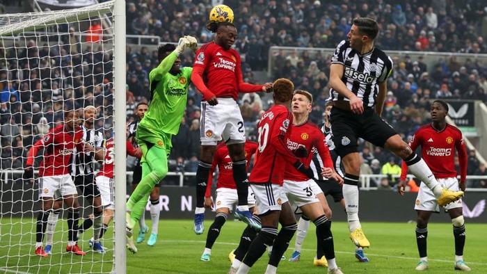 Andre Onana NEWCASTLE UPON TYNE, ENGLAND - DECEMBER 02: Andre Onana of Manchester United punches the ball clear during the Premier League match between Newcastle United and Manchester United at St. James Park on December 02, 2023 in Newcastle upon Tyne, England. (Photo by Clive Brunskill/Getty Images)