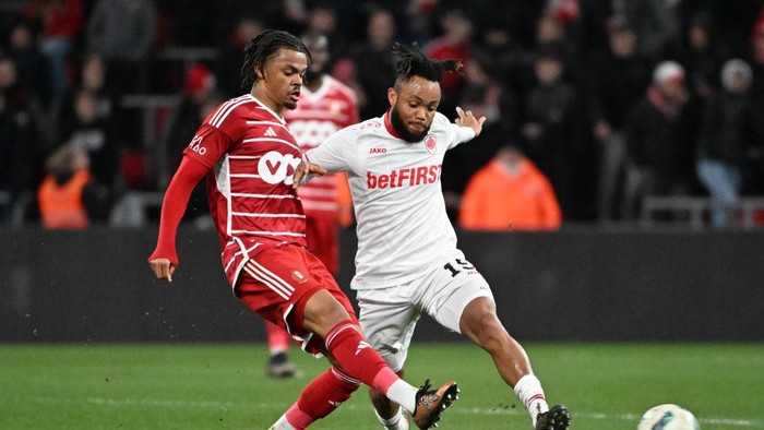 LIEGE, BELGIUM - JANUARY 31: Lucas Noubi of Standard battles for the ball with Chidera Ejuke of Antwerp during a football game between Standard de Liege and Royal Antwerp FC on match day 23 of the Jupiler Pro League season 2023 - 2024 competition on January 31, 2024 in Liege, Belgium. (Photo by Isosport/MB Media/Getty Images)