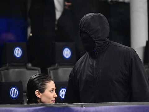 US rapper Kanye West and girlfriend Bianca Censori are seen in the stands during the UEFA Champions League last 16 first leg football match Inter Milan vs Atletico Madrid at the San Siro stadium in Milan on February 20, 2024. (Photo by Marco BERTORELLO / AFP)