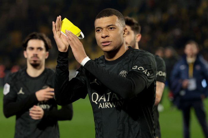 Kylian Mbappe NANTES, FRANCE - FEBRUARY 17: Kylian Mbappe of PSG salutes the supporters following the Ligue 1 Uber Eats match between FC Nantes (FCN) and Paris Saint-Germain (PSG) at Stade de la Beaujoire on February 17, 2024 in Nantes, France. (Photo by Jean Catuffe/Getty Images)