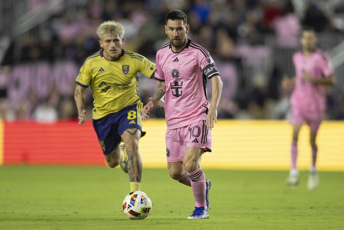Feb 21, 2024; Fort Lauderdale, Florida, USA; Inter Miami forward Lionel Messi (10) kicks the ball past Real Salt Lake midfielder Diego Luna (8) in the first half at Chase Stadium. Mandatory Credit: Sam Navarro-USA TODAY Sports