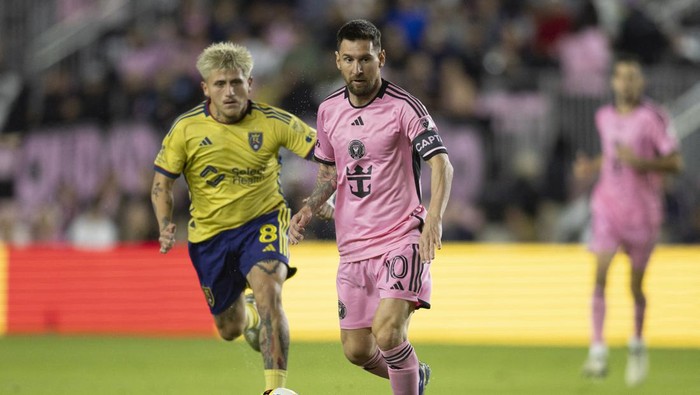 Feb 21, 2024; Fort Lauderdale, Florida, USA; Inter Miami forward Lionel Messi (10) kicks the ball past Real Salt Lake midfielder Diego Luna (8) in the first half at Chase Stadium. Mandatory Credit: Sam Navarro-USA TODAY Sports