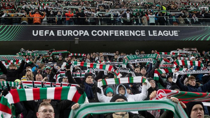 Legia Warsaw fans are cheering during the UEFA Europa Conference League match against AZ Alkmaar in Warsaw, Poland, on December 14, 2023. (Photo by Tomasz Jastrzebowski/Foto Olimpik)