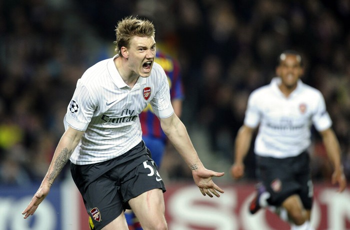 Arsenals Nicklas Bendtner from Denmark, left, reacts after scoring a goal against Barcelona during their Champions League quarterfinal second leg soccer match at the Camp Nou Stadium in Barcelona, Tuesday, April 6, 2010. (AP Photo/Daniel Ochoa de Olza)