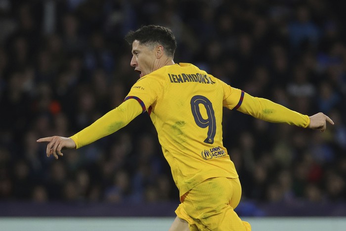 Robert Lewandowski Barcelona's Robert Lewandowski celebrates after scoring his side's first goal of the game during the Champions League round of 16 first leg soccer match between Napoli and Barcelona at the Diego Armando Maradona Stadium in Naples, Italy, Wednesday, Feb. 21, 2024. (Alessandro Garofalo/LaPresse via AP)