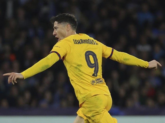 Barcelona's Robert Lewandowski celebrates after scoring his side's first goal of the game during the Champions League round of 16 first leg soccer match between Napoli and Barcelona at the Diego Armando Maradona Stadium in Naples, Italy, Wednesday, Feb. 21, 2024. (Alessandro Garofalo/LaPresse via AP)