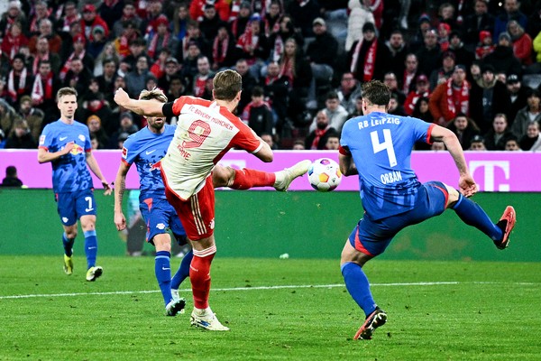 24 February 2024, Bavaria, Munich: Soccer: Bundesliga, Bayern Munich - RB Leipzig, Matchday 23, Allianz Arena. Harry Kane of Munich (l) scores the goal against Willi Orban of Leipzig to make it 2-1. Photo: Tom Weller/dpa (Photo by Tom Weller/picture alliance via Getty Images)