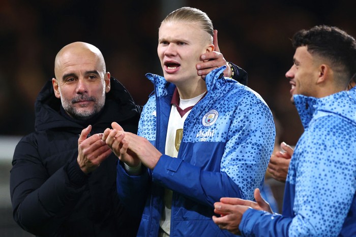 BOURNEMOUTH, ENGLAND - FEBRUARY 24: Pep Guardiola, Manager of Manchester City, embraces Erling Haaland of Manchester City following the Premier League match between AFC Bournemouth and Manchester City at the Vitality Stadium on February 24, 2024 in Bournemouth, England. (Photo by Clive Rose/Getty Images)