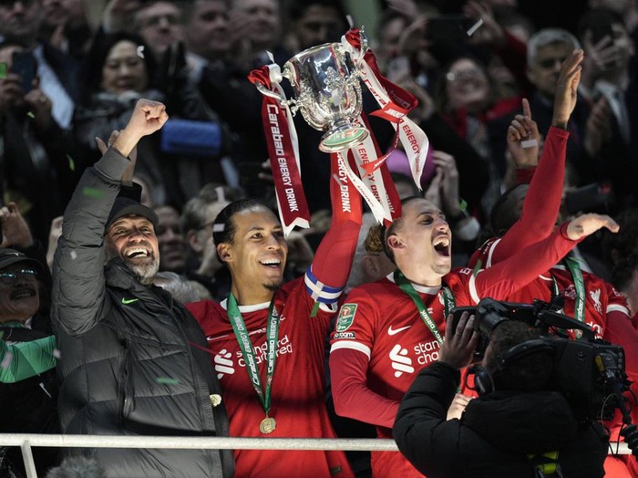 Liverpool's Virgil van Dijk celebrates after scoring his side's first goal during the English League Cup final soccer match between Chelsea and Liverpool at Wembley Stadium in London, Sunday, Feb. 25, 2024. (AP Photo/Alastair Grant)