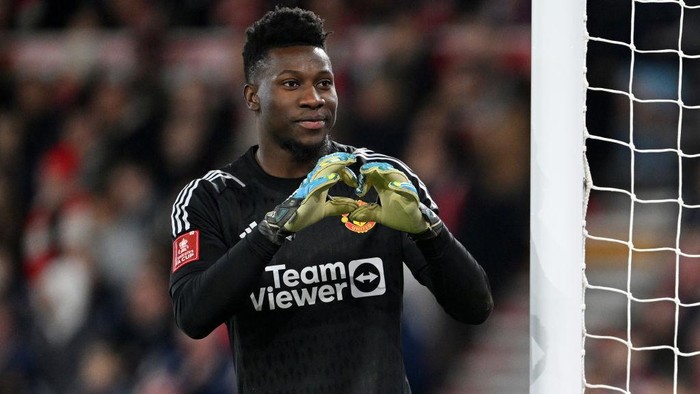 NOTTINGHAM, ENGLAND - FEBRUARY 28: Andre Onana of Manchester United forms the shape of a heart with his hands as he reacts during the Emirates FA Cup Fifth Round match between Nottingham Forest and Manchester United at City Ground on February 28, 2024 in Nottingham, England. (Photo by Michael Regan/Getty Images)