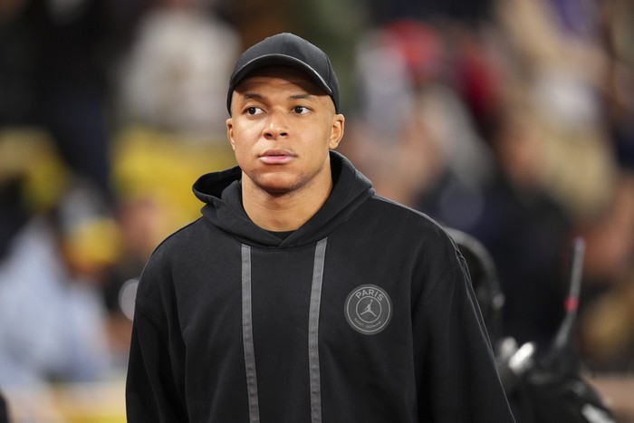 PSGs Kylian Mbappe heads away from the pitch after the French League One soccer match between Monaco and Paris Saint-Germain at the Stade Louis II in Monaco, Friday, March 1, 2024. The match ended in a 0-0 draw. (AP Photo/Daniel Cole)