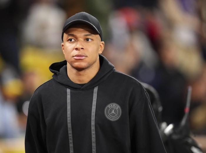 PSG's Kylian Mbappe heads away from the pitch after the French League One soccer match between Monaco and Paris Saint-Germain at the Stade Louis II in Monaco, Friday, March 1, 2024. The match ended in a 0-0 draw. (AP Photo/Daniel Cole)