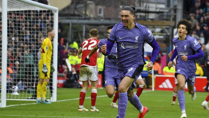 Liverpools Darwin Nunez celebrates after scoring his sides opening goal during the English Premier League soccer match between Nottingham Forest and Liverpool at City ground in Nottingham, England, Saturday, March 2, 2024. (AP Photo/Rui Vieira)