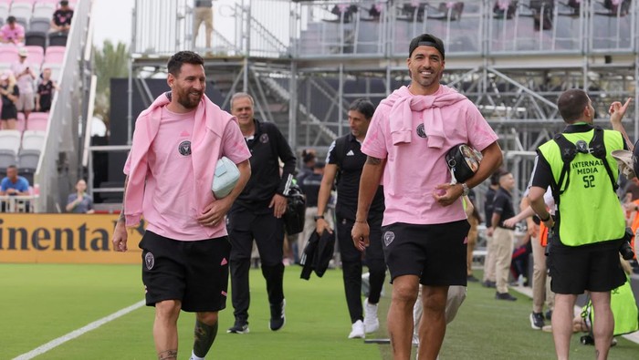 Mar 2, 2024; Fort Lauderdale, Florida, USA; Inter Miami CF forward Lionel Messi (10) and forward Luis Suarez (9) walk onto the field before the game against Orlando City at Chase Stadium. Mandatory Credit: Sam Navarro-USA TODAY Sports