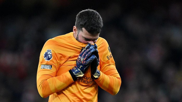 LONDON, ENGLAND - FEBRUARY 04: Alisson Becker of Liverpool looks dejected after the teams defeat in the Premier League match between Arsenal FC and Liverpool FC at Emirates Stadium on February 04, 2024 in London, England. (Photo by Shaun Botterill/Getty Images)