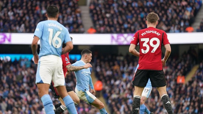 Manchester Citys Phil Foden (centre) scores their sides first goal of the game during the Premier League match at the Etihad Stadium, Manchester. Picture date: Sunday March 3, 2024. (Photo by Mike Egerton/PA Images via Getty Images)