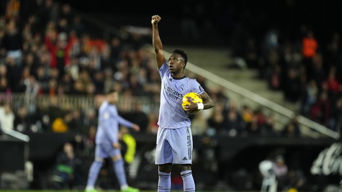 Real Madrids Vinicius Junior celebrates after scoring his sides first goal during the La Liga soccer match between Valencia and Real Madrid at the Mestalla Stadium in Valencia, Spain, Saturday, March 2, 2024. (AP Photo/Jose Breton)