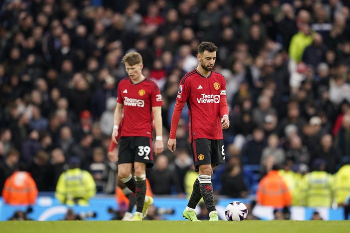 Manchester Uniteds Scott McTominay, left and Manchester Uniteds Bruno Fernandes react after Manchester Citys Phil Foden scored his sides second goal during an English Premier League soccer match between Manchester City and Manchester United at the Etihad Stadium in Manchester, England, Sunday, March 3, 2024. (AP Photo/Dave Thompson)