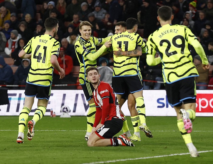 Martin Odegaard Soccer Football - Premier League - Sheffield United v Arsenal - Bramall Lane, Sheffield, Britain - March 4, 2024 Arsenal's Gabriel Martinelli celebrates scoring their third goal with teammates Action Images via Reuters/Jason Cairnduff NO USE WITH UNAUTHORIZED AUDIO, VIDEO, DATA, FIXTURE LISTS, CLUB/LEAGUE LOGOS OR 'LIVE' SERVICES. ONLINE IN-MATCH USE LIMITED TO 45 IMAGES, NO VIDEO EMULATION. NO USE IN BETTING, GAMES OR SINGLE CLUB/LEAGUE/PLAYER PUBLICATIONS.