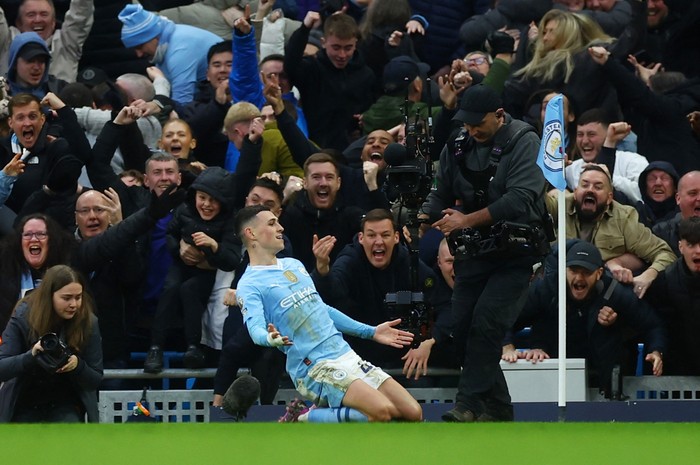 Soccer Football - Premier League - Manchester City v Manchester United - Etihad Stadium, Manchester, Britain - March 3, 2024 Manchester Citys Phil Foden celebrates scoring their second goal Action Images via Reuters/Lee Smith NO USE WITH UNAUTHORIZED AUDIO, VIDEO, DATA, FIXTURE LISTS, CLUB/LEAGUE LOGOS OR LIVE SERVICES. ONLINE IN-MATCH USE LIMITED TO 45 IMAGES, NO VIDEO EMULATION. NO USE IN BETTING, GAMES OR SINGLE CLUB/LEAGUE/PLAYER PUBLICATIONS.