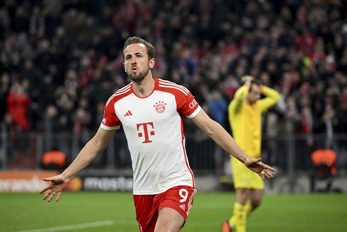 Bayerns Harry Kane celebrates after scoring his sides opening goal during the Champions League round of 16 second leg soccer match between FC Bayern Munich and Lazio at the Allianz Arena stadium in Munich, Germany, Tuesday, March 5, 2024. (Sven Hoppe/DPA via AP)
