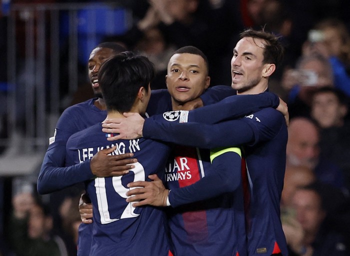Soccer Football - Champions League - Round of 16 - Second Leg - Real Sociedad v Paris St Germain - Reale Arena, San Sebastian, Spain - March 5, 2024 Paris St Germains Kylian Mbappe celebrates scoring their second goal with Lee Kang-in, Ousmane Dembele and Fabian Ruiz REUTERS/Juan Medina