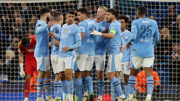 Soccer Football - Champions League - Round of 16 - Second Leg - Manchester City v FC Copenhagen - Etihad Stadium, Manchester, Britain - March 6, 2024 Manchester Citys Erling Braut Haaland celebrates scoring their third goal with teammates REUTERS/Phil Noble