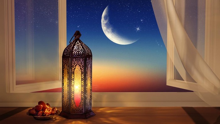 Ramadan lantern by the open window. Beautiful Greeting Card with copy space for bulan berkat and Muslim Holidays. An illuminated Arabic lamp. Mixed media.