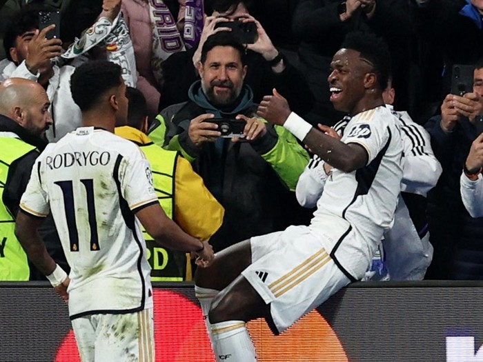 Susah Payah Real Madrid Lolos ke Perempatfinal Liga Champions Soccer Football - Champions League - Round of 16 - Second Leg - Real Madrid v RB Leipzig - Santiago Bernabeu, Madrid, Spain - March 6, 2024 Real Madrid's Vinicius Junior celebrates scoring their first goal with Rodrygo REUTERS/Violeta Santos Moura