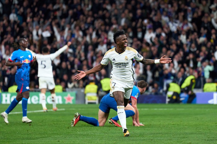 vinicius junior real madrid vs rb leipzig madrid vs leipzig babak 16 besar liga champions babak 16 besar liga champions MADRID, SPAIN - MARCH 06: Vinicius Junior of Real Madrid celebrates after scoring the team's first goal during the UEFA Champions League 2023/24 round of 16 second leg match between Real Madrid CF and RB Leipzig at Estadio Santiago Bernabeu on March 06, 2024 in Madrid, Spain. (Photo by Angel Martinez/Getty Images)