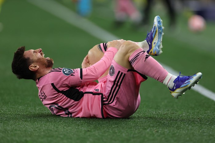 NASHVILLE, TENNESSEE - MARCH 07: Lionel Messi #10 of Inter Miami CF reacts after suffering an injury against Nashville SC during the second half during the Concacaf Champions Cup Leg One Round of 16 match at GEODIS Park on March 07, 2024 in Nashville, Tennessee. (Photo by Donald Page/Getty Images)