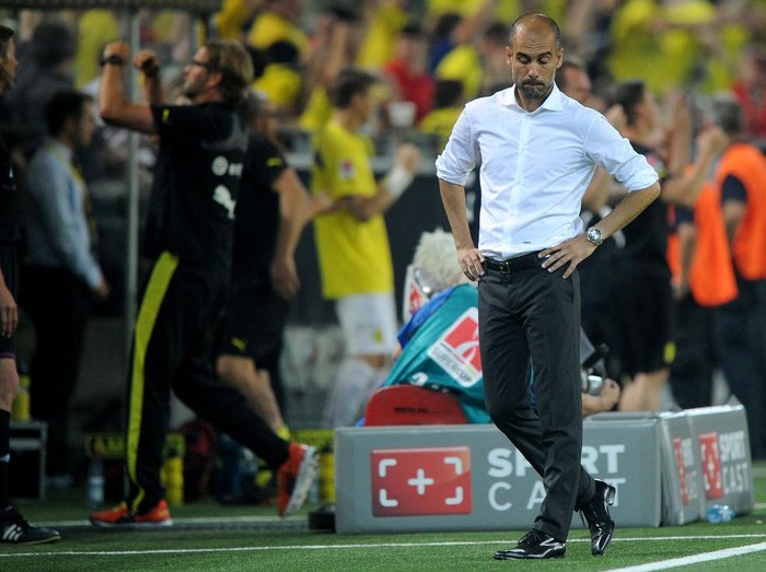 Munich's head coach Pep Guardiola (R) gestures after the 4-2 match, while Dortmund's head coach Juergen Klopp (L) cheers during the super cup match between Borussia Dortmund and FC Bayern Munich at Signal-Iduna-Park in Dortmund, Germany, 27 July 2013. Photo: Jonas Guettler | usage worldwide   (Photo by Jonas Güttler/picture alliance via Getty Images)